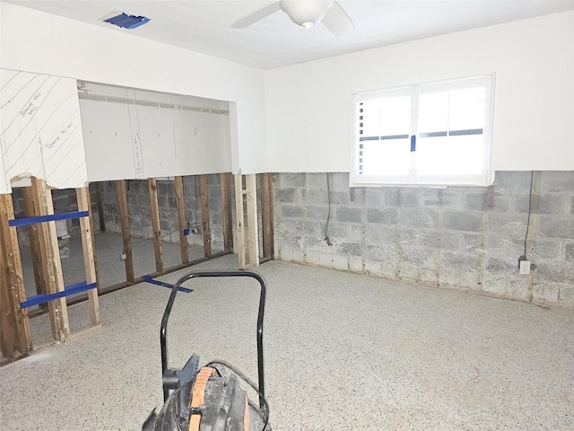 basement featuring ceiling fan