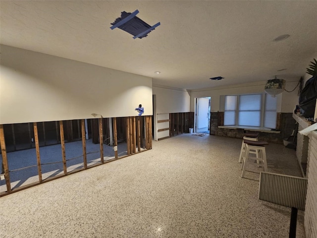 interior space featuring a textured ceiling