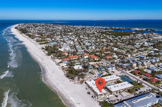 aerial view with a water view and a beach view