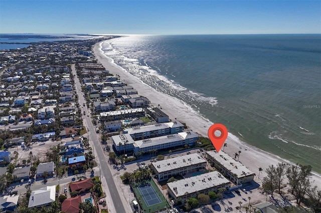 drone / aerial view featuring a water view and a beach view