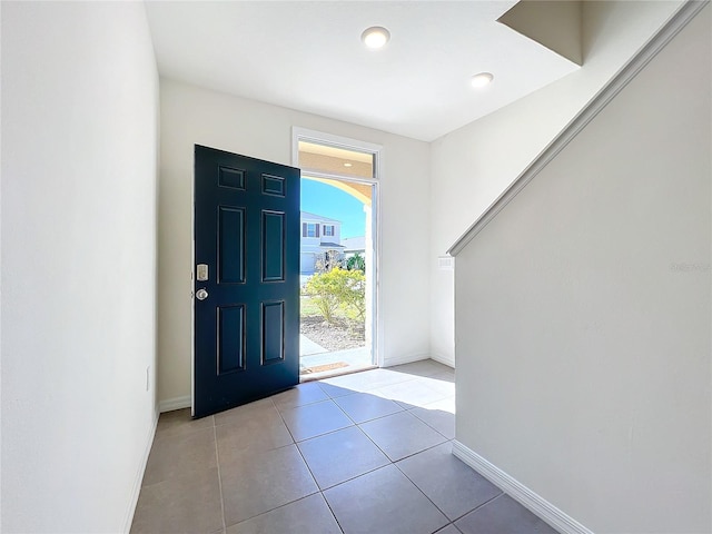 foyer entrance with light tile patterned floors