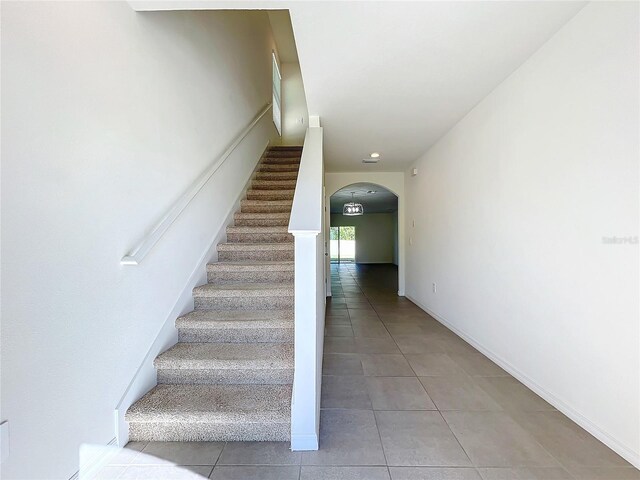 staircase with tile patterned flooring