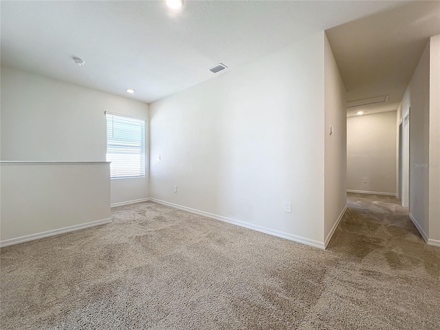 spare room featuring carpet floors