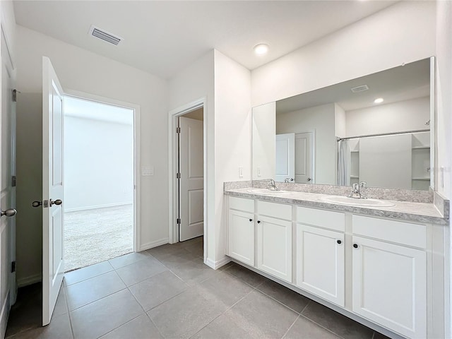 bathroom with vanity and tile patterned floors