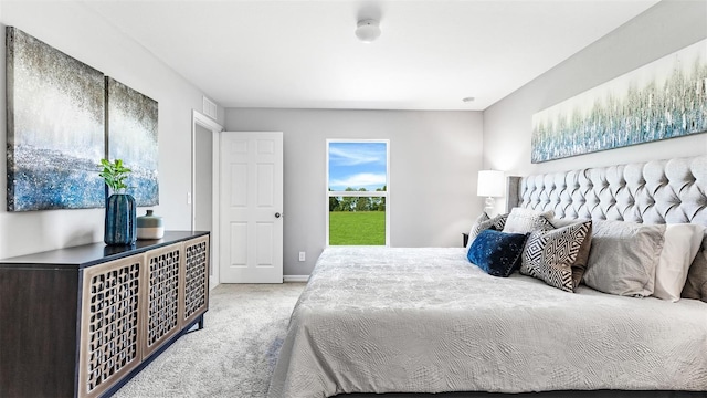 bedroom featuring light carpet