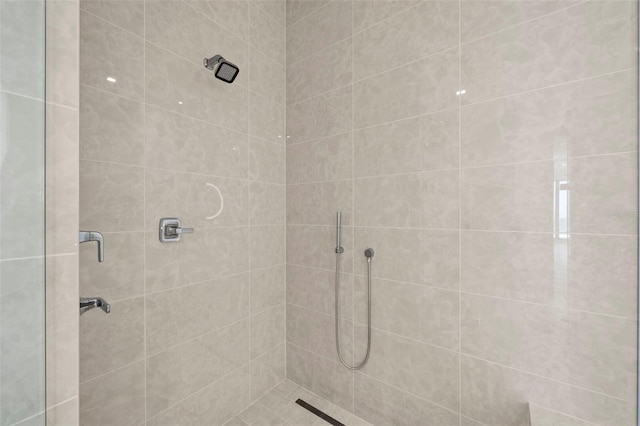 bathroom with tiled shower