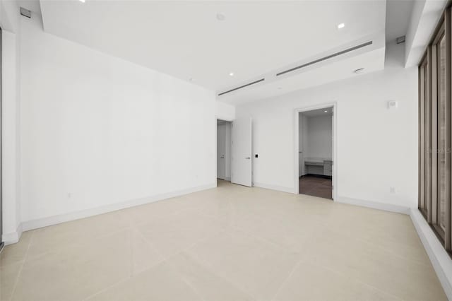 unfurnished room featuring light tile patterned floors