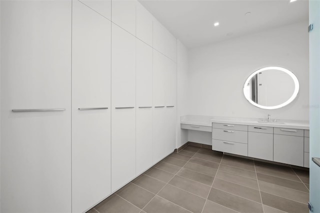 interior space with tile patterned flooring and sink