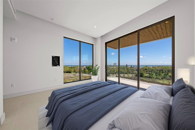 tiled bedroom featuring access to outside and multiple windows