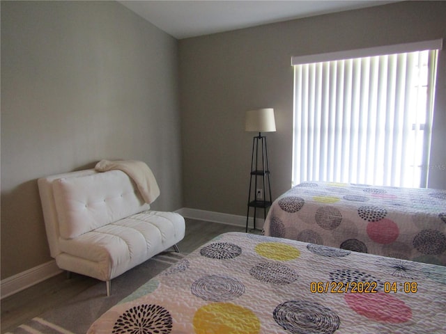 bedroom with hardwood / wood-style floors