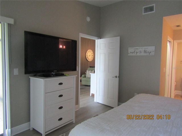 bedroom with light hardwood / wood-style floors