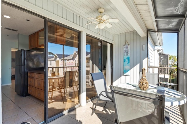 sunroom / solarium with ceiling fan