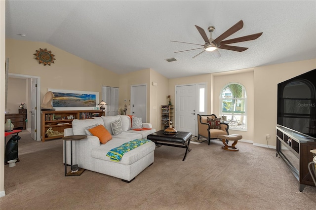 living room with a textured ceiling, ceiling fan, light colored carpet, and lofted ceiling