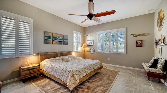 bedroom with ceiling fan and light tile patterned floors