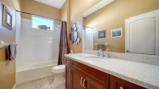 full bathroom featuring tile patterned flooring, shower / tub combo, vanity, and toilet