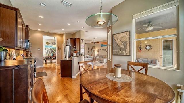 1330 Still River Dr, Venice, FL 34293 - dining area featuring a ceiling fan, light wood finished floors, recessed lighting, and baseboards