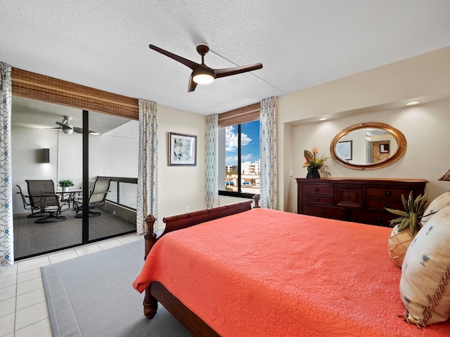 bedroom featuring access to exterior, a textured ceiling, ceiling fan, and light tile patterned flooring