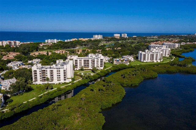 birds eye view of property featuring a water view