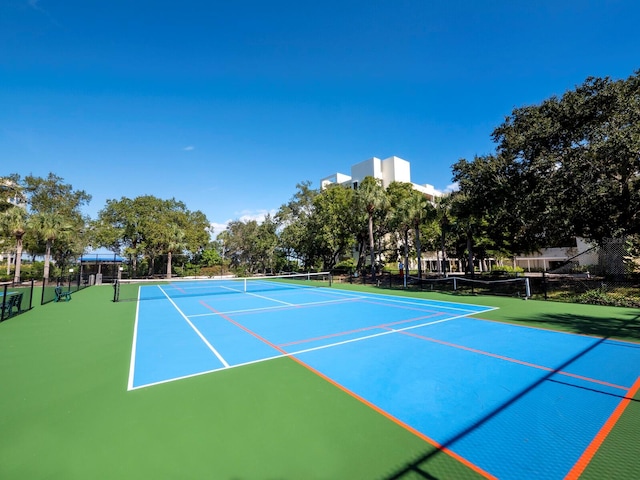 view of sport court with basketball hoop