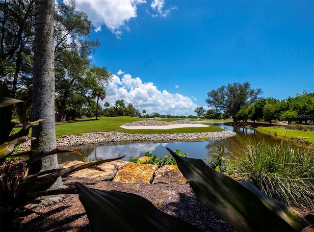 surrounding community featuring a water view