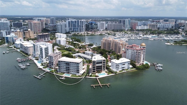 bird's eye view featuring a view of city and a water view