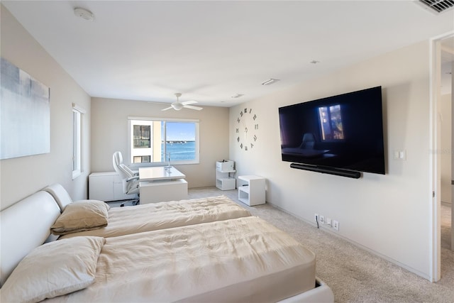 bedroom with light carpet and ceiling fan