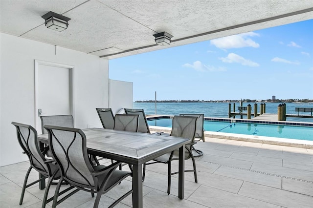 view of patio with a water view