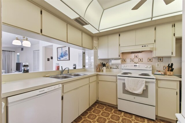 kitchen with backsplash, white appliances, ceiling fan, sink, and cream cabinetry