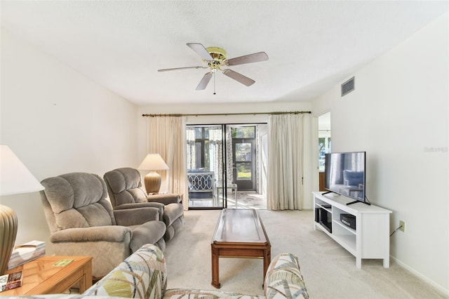 living room featuring ceiling fan and light carpet