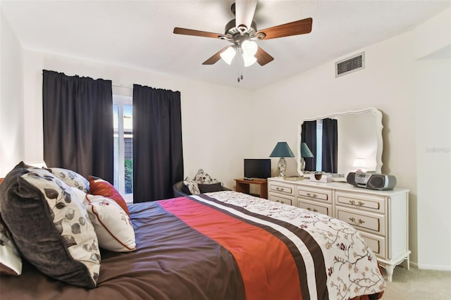 bedroom featuring ceiling fan and light carpet