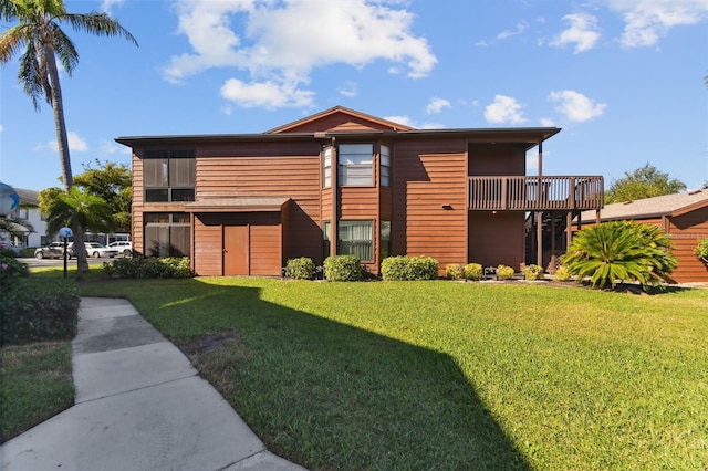 exterior space with a balcony and a front lawn