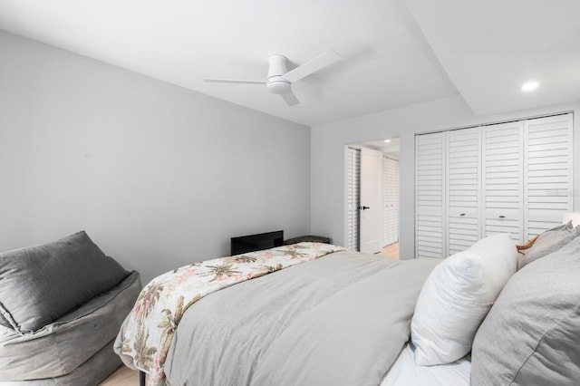 bedroom with ceiling fan and a closet