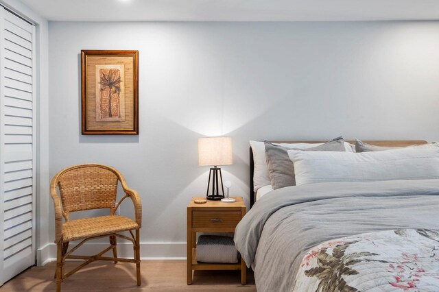 bedroom with hardwood / wood-style floors