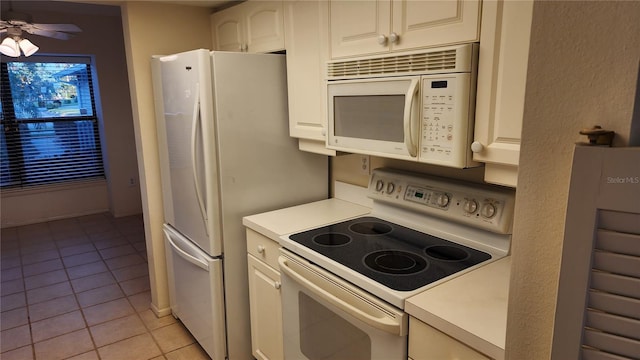 kitchen with white cabinets, ceiling fan, light tile patterned floors, and white appliances