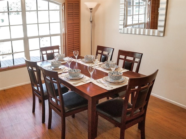 3405 Highland Ave W, Bradenton, FL 34205 - dining room featuring healthy amount of natural light, baseboards, and wood finished floors