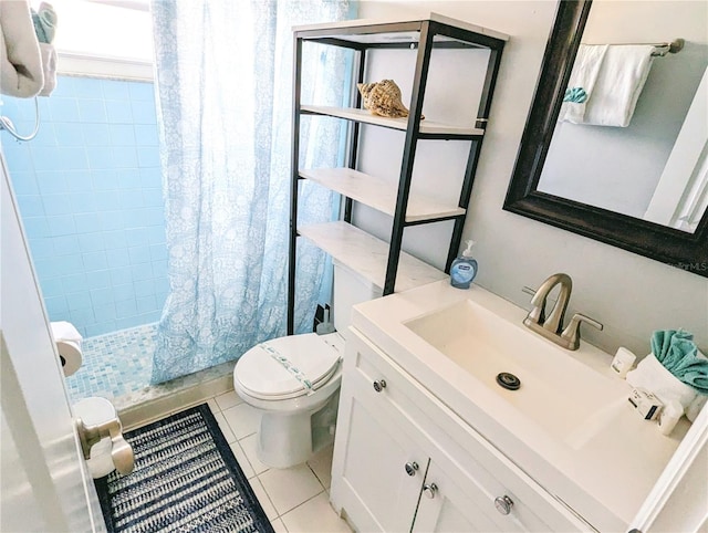 full bathroom featuring a shower with shower curtain, vanity, toilet, and tile patterned floors