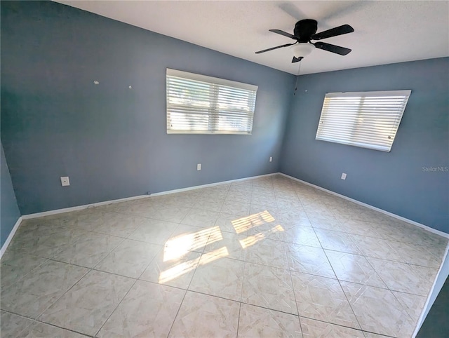 3405 Highland Ave W, Bradenton, FL 34205 - tiled spare room featuring a ceiling fan and baseboards