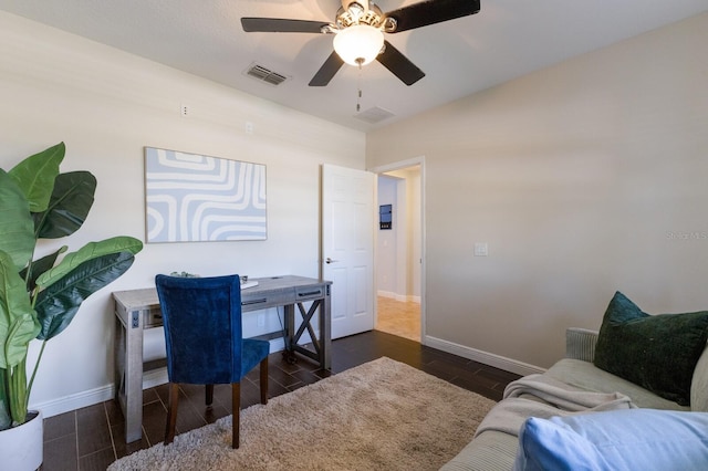 office featuring dark hardwood / wood-style floors and ceiling fan