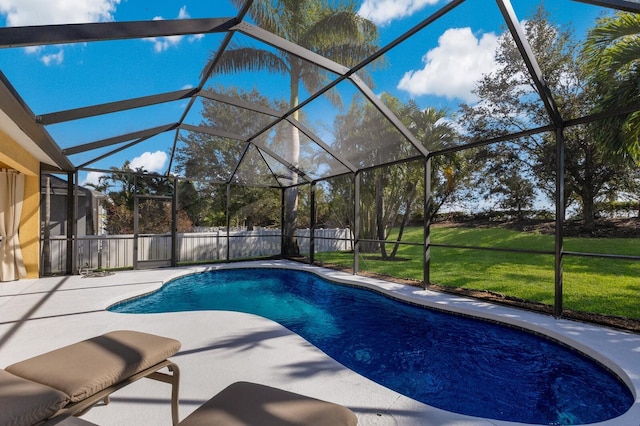 view of pool with a lanai, a yard, and a patio