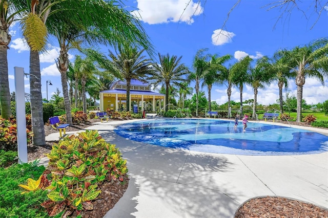 view of swimming pool featuring pool water feature