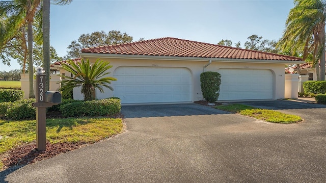 mediterranean / spanish-style home featuring a garage