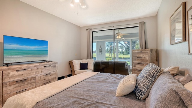 bedroom with ceiling fan, lofted ceiling, a textured ceiling, and access to outside