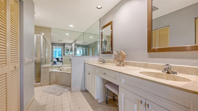 bathroom featuring vanity, tile patterned floors, and independent shower and bath