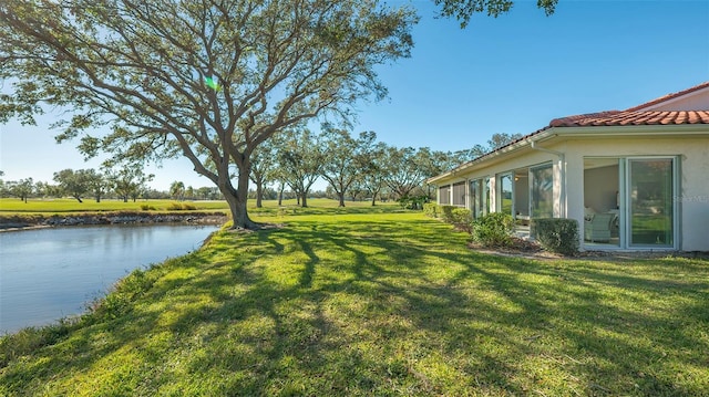 view of yard with a water view