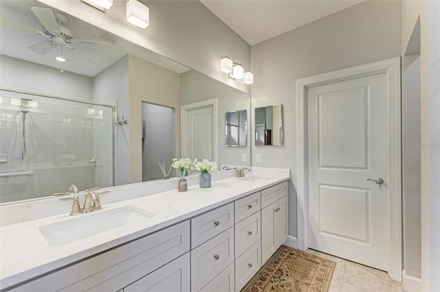 bathroom with tile patterned floors, vanity, ceiling fan, and a shower with door