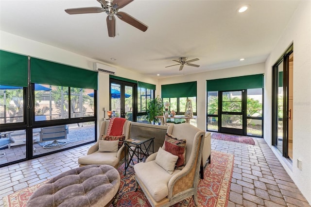 sunroom / solarium with an AC wall unit and ceiling fan