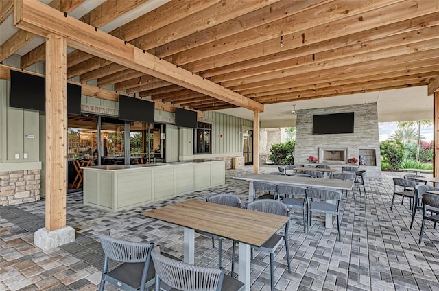 view of patio / terrace with an outdoor stone fireplace