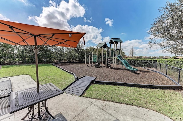 view of jungle gym featuring a lawn