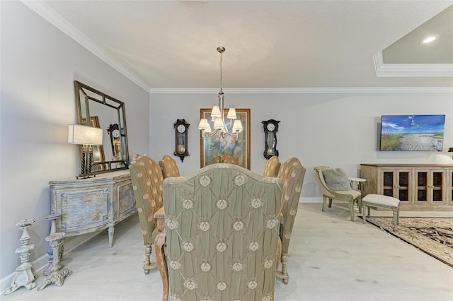 dining room featuring a chandelier and crown molding