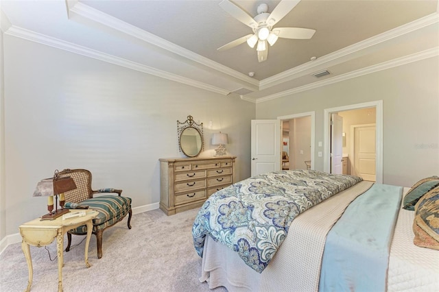 bedroom with a tray ceiling, ceiling fan, crown molding, and light carpet